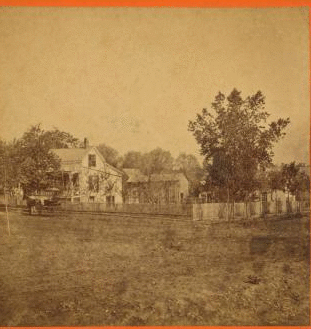 A home surrounded by a picket fence in Leavenworth. 1868?-1906?