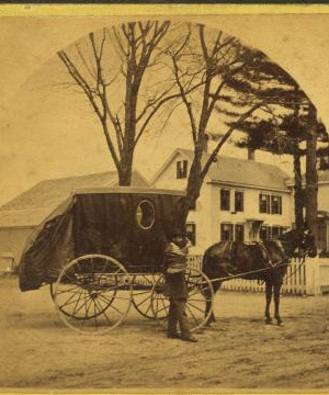 [View of a salesman(?) from the Excelsior straw Works in Medfield, holding a stack of hats and standing next to his wagon.] 1859?-1885?