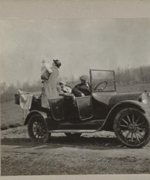 [Family in touring car.] 1915-1919 April 1916