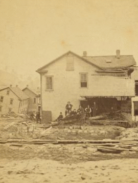 [Group in front of ruined home, Johnstown, Pa.] 1889