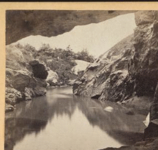 Central Park. View from interior of Cave, looking out. [1860?-1875?]