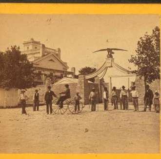 [Eagle Gate (including a view with man on bicycle in front).] 1860-1885?
