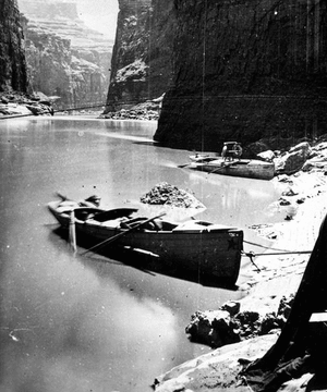 Two boats in Marble Canyon, Colorado River. Major Powell's armchair in on one of the boats.