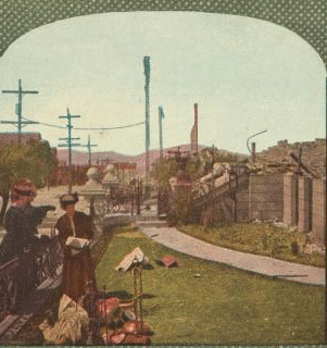 Gathering a few home relics at the ruins of the at the ruins of the Wenban Palace, Van Ness Ave., San Francisco. 1906