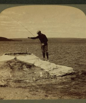 Fisherman at lake turning to cook in a boiling spring the trout just caught, Yellowstone Park, U.S.A. 1901, 1903, 1904