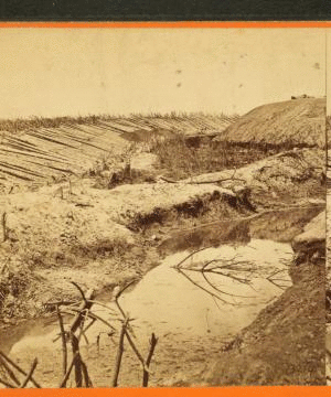 Ditch and "Chevaux de frise" in front of the Union Fort Sedgwick, called by the Rebel soldiers "Fort Hell."... 1861-1865