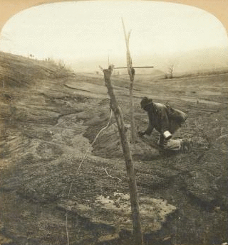 Planting a twig where he supposes his wife and ten children, victims of distant steaming Souffriere, are buried, St. Vincent, W. I. 1902