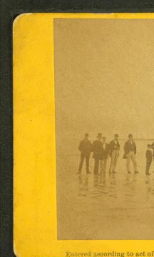 Landing of the French Atlantic telegraph cable on Duxbury Beach, with the officers of the steamers and barges that landed the cable on shore, in the foreground. 1860?-1880?