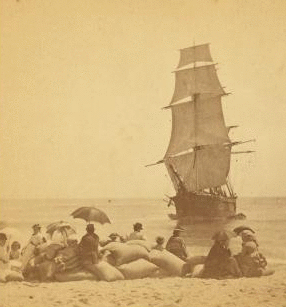 [View of the wreck of the "Minmanuett," showing spectators sitting on bags of coffee (its cargo) on the shore.] 1867?-1890?