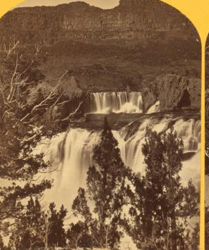 Shoshone Falls, Snake River, Idaho, looking through the timber, and showing the main fall, and upper or "Lace Falls." 1874