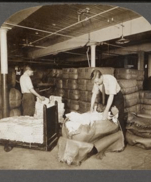 Opening bales of raw silk as it arrives from China, Japan and Italy. Silk industry (reeled silk), South Manchester, Conn., U.S.A. c1914 1914