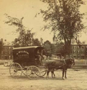 [Wagon with "A. Wilson, Baker, Lawrence" on the canopy.] 1869?-1910?