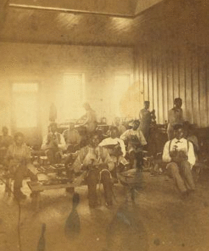 [Native American students in a workshop at the United States Indian Industrial Training School.] 187- 1865?-1885?