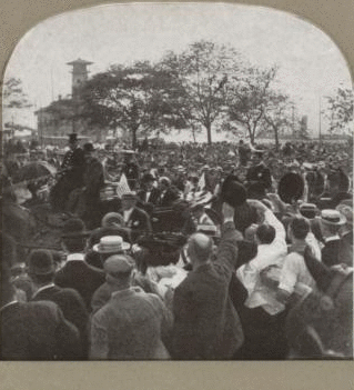 Castle Garden, now the aquarium, with a very interesting foreground [large crowd of people, some waving at a procession, in foreground]. 1865?-1910?