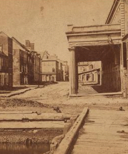 War views. Vendree Range, one of the principal business streets, Charleston, S.C. (The building on the left is where the first shell struct.) 1860?-1903?