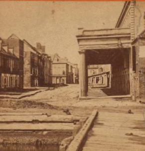 War views. Vendree Range, one of the principal business streets, Charleston, S.C. (The building on the left is where the first shell struct.) 1860?-1903?