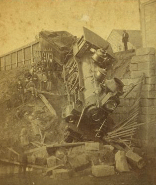 [People posing with train engine that derailed at bridge.] 1868?-1885?