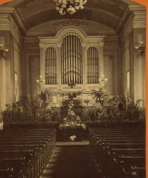 [Interior of a church, showing flower arrangements and a large organ.] 1865?-1903