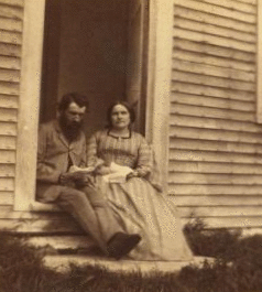 [Portrait of an unidentified couple sitting in the doorway of a house, Casco Bay, Maine.] 1865?-1882?