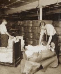 Opening bales of raw silk as it arrives from China, Japan and Italy. Silk industry (reeled silk), South Manchester, Conn., U.S.A. c1914 1914