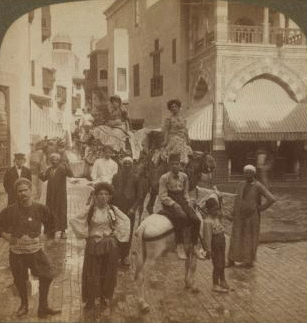 Picturesque natives of Egypt in the crooked streets of "Cairo," World's Fair, St. Louis. 1903-1905 1904