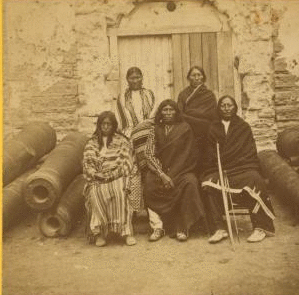 Group of the 3 most celebrated Indian Chiefs and 2 women prisoners, confined in the Old Spanish Fort. 1868?-1890? [1875-1878]