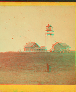 [Veiw of a lighthouse with a man standing in the foreground.] 1863?-1885?