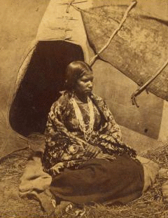 [Portrait of native American woman in front of teepee.] 1862?-1875?