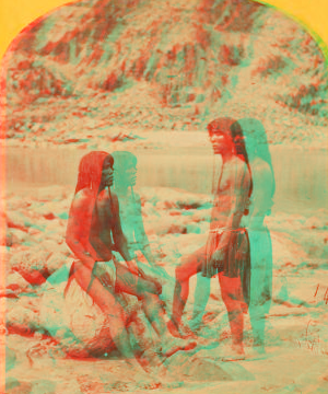 Types of Mojave Indians. [Two Mojave men pose on rocks in front of the river.] 1871