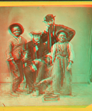 Shoe Blacks. [Studio portrait of three young shoe shiners and their customers.] 1868?-1900?