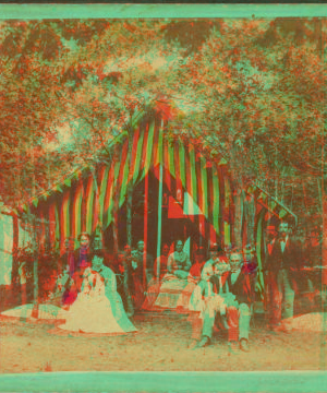 [Group posed in front of a tent.] 1868?-1880?