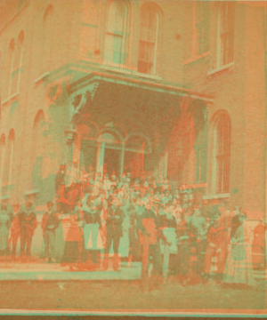 [Clinton: group of young men and women posing on steps of a school (?).] 1865?-1900? 1883-1886