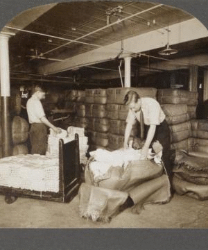 Opening bales of raw silk as it arrives from China, Japan and Italy. Silk industry (reeled silk), South Manchester, Conn., U.S.A. c1914 1914