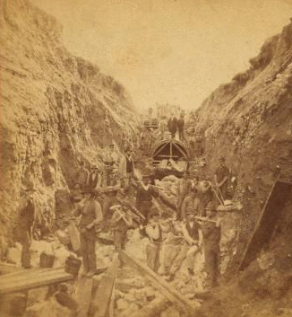 Sudbury River Conduit, B.W.W., div. 4, sec. 17, Nov. 13, 1876. View near rock-cut on sec. 17 showing ledgemen in the foreground and brickmasons in the background. 1876 1876?-1878?