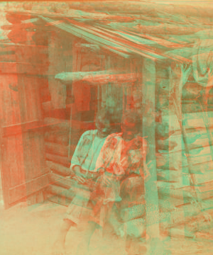 Happy little Bob and his fiddle.  [Man playing fiddle in front of cabin.] 1868?-1900?