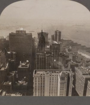 Looking Down on New York's Skyscrappers -- From Woolworth Tower (S.W.) Over Battery to Statue of Liberty and Harbor. [ca. 1890] 1862?-1920?