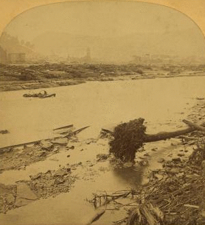 A distant view of Johnstown from the P. R. R. above the city, showing all that remains of the Roman Catholic Church of the Immaculate Conception. 1889