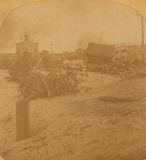 From the rear of the P. R. R. depot looking toward the Stone Bridge, where so many people were burned to death. 1889