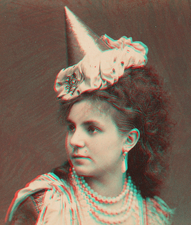 Woman wearing pearls and pointed hat