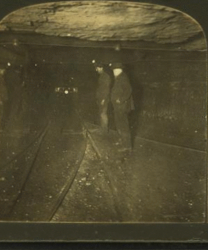 Group of miners in the main tunnel (1 1/2 miles long) of a huge coal mine, Pittsburg, Pa., U.S.A. 1868?-1915?