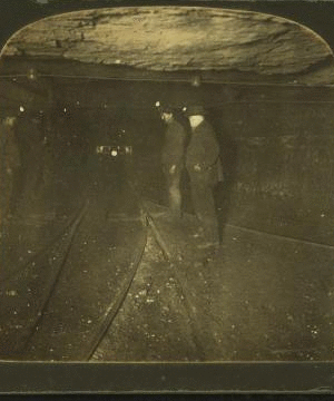 Group of miners in the main tunnel (1 1/2 miles long) of a huge coal mine, Pittsburg, Pa., U.S.A. 1868?-1915?