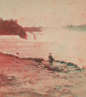 [Man standing near top of Horseshoe Falls.] [1860?-1885?]