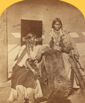 Jicarilla brave and squaw, lately wedded. Abiquiu Agency, New Mexico. 1874