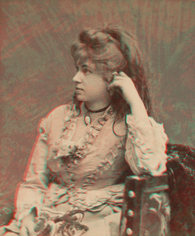 Seated woman in ruffled blouse