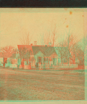 [Unidentified home at a cross roads surrounded by a picket fence.] 1859?-1870?