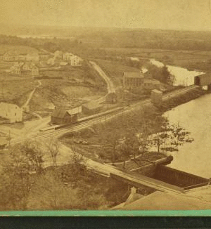 [Aerial view of the village of Anthony, Rhode Island, including Laurel Avenue next to the dam, Pilgrim Avenue on the far side of the railroad tracks, and J.H. Capwell Company buildings, near the bridge.] 1860?-1885?