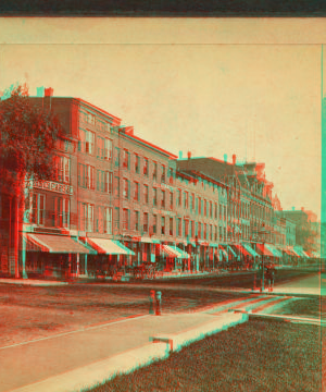 [View of a commerical street.] 1865?-1905?