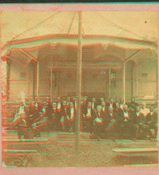 Group of men posing at the preacher's stand. 1863?-1885?