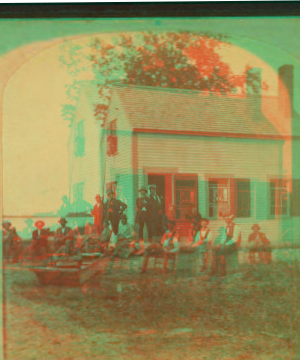 [Group portrait of people in front of a house.] 1865?-1885?