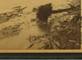 A distant view of Johnstown from the P. R. R. above the city, showing all that remains of the Roman Catholic Church of the Immaculate Conception. 1889